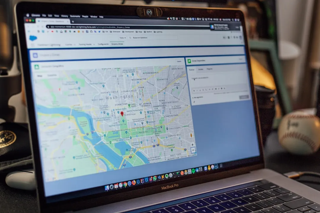 Travel planning workspace with world map, laptop showing flight bookings, coffee, and destination notes