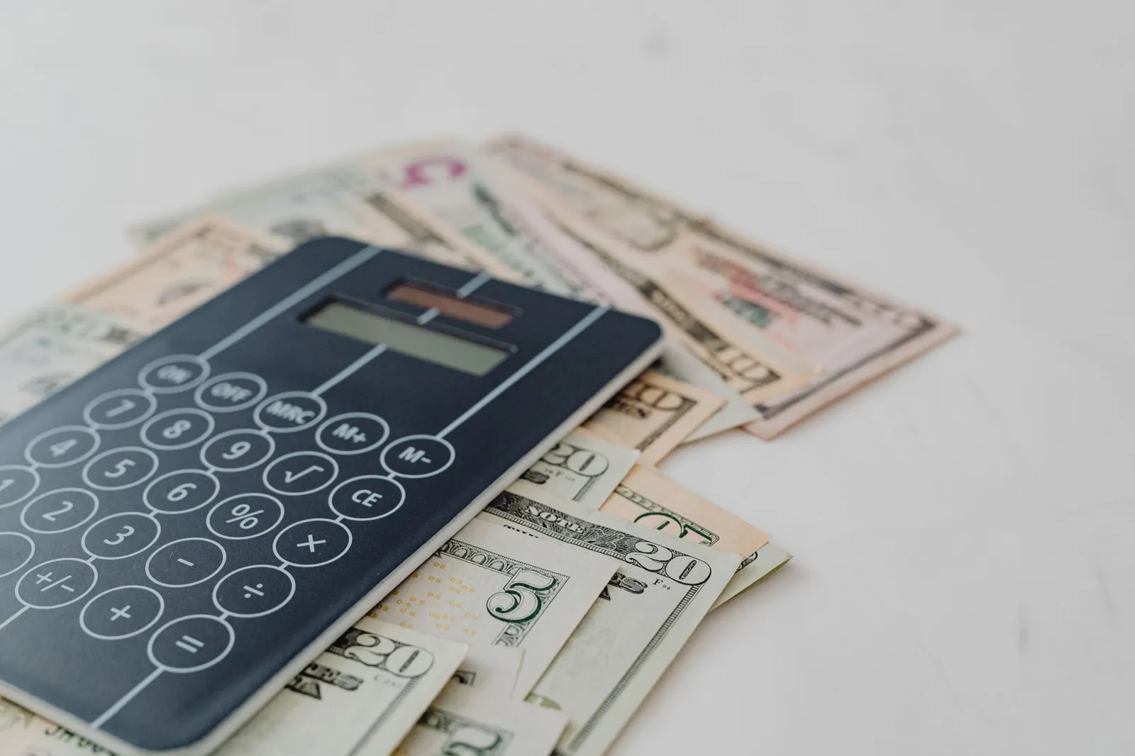Calculator showing interest charges versus balance transfer fee comparison