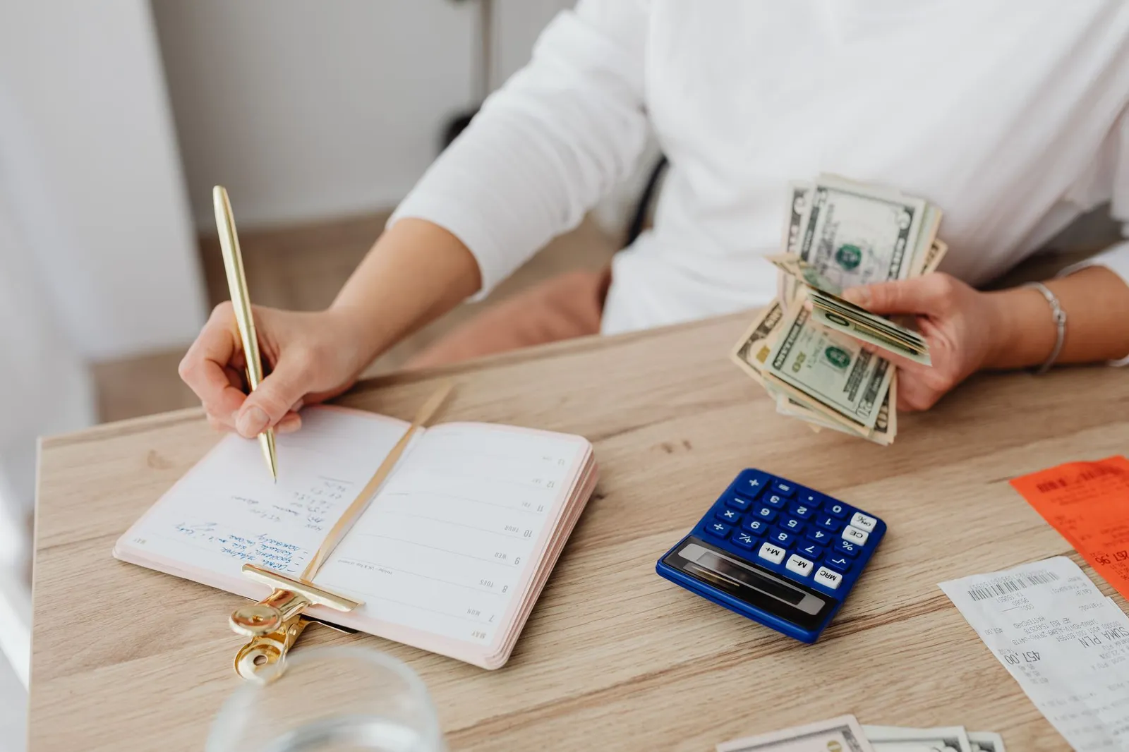 Planner and credit card showing scheduled payment dates and financial tracking