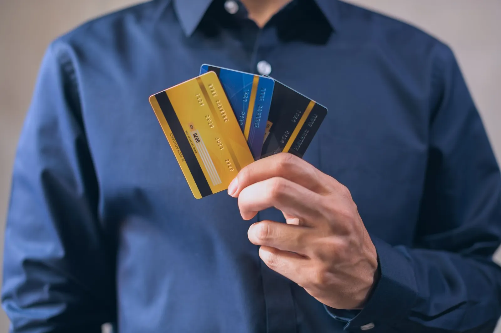 Credit score documents and applications on desk with reading glasses