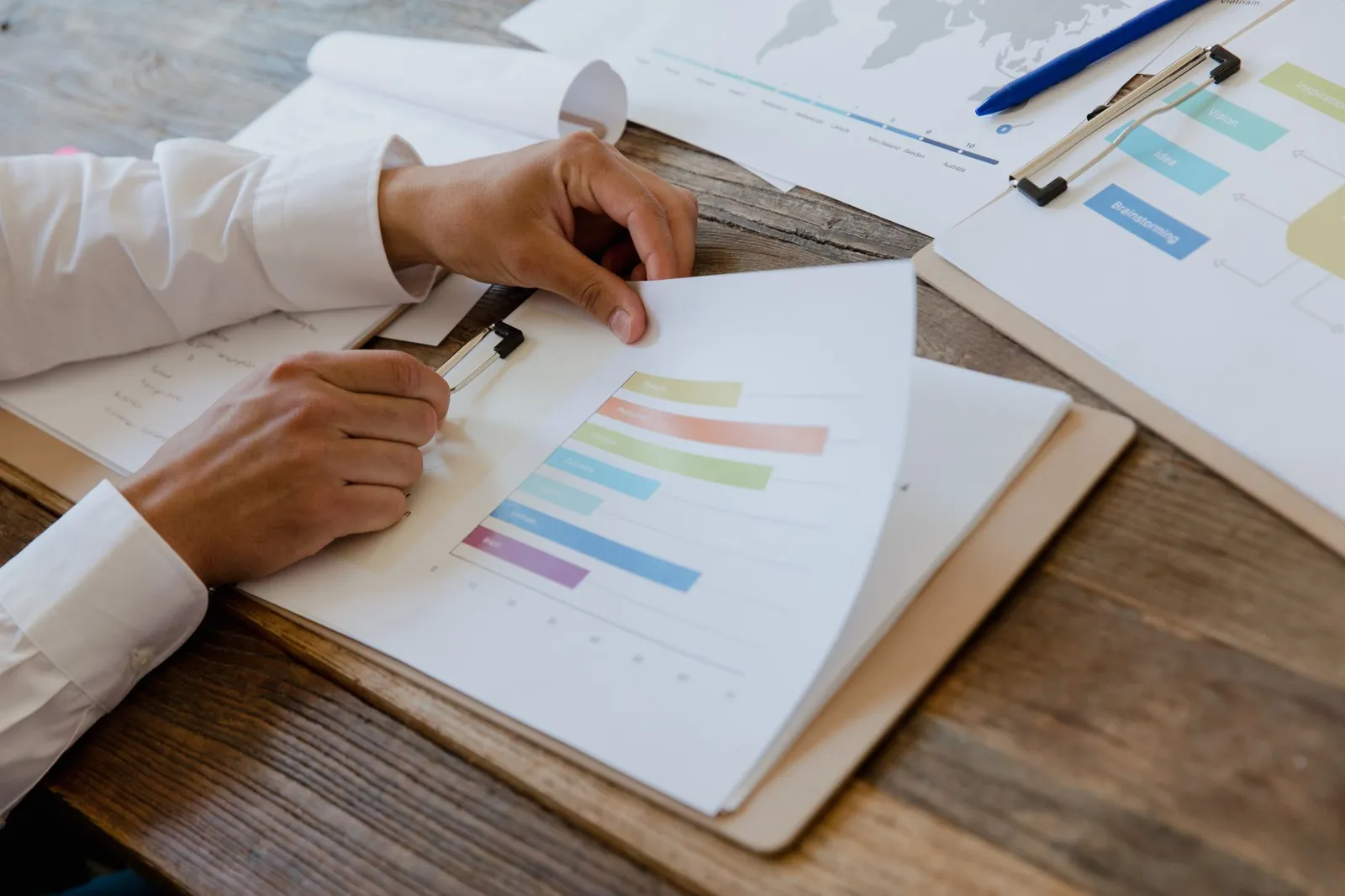 Person reviewing credit documents and score report