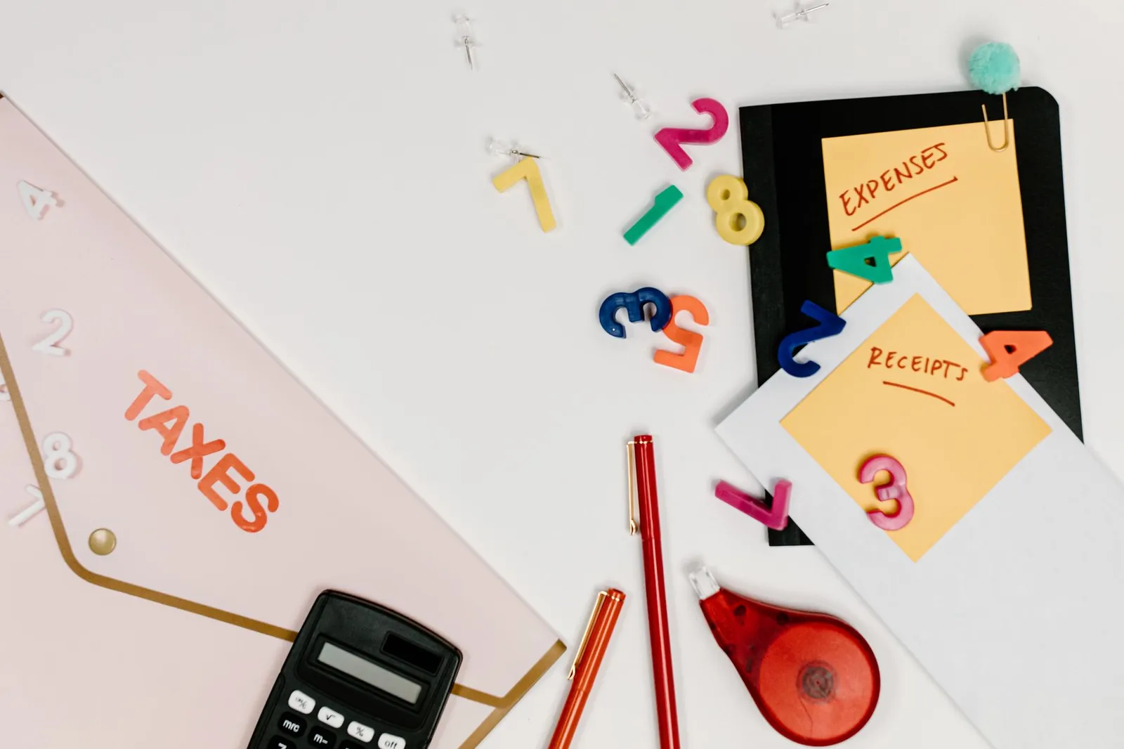 Organized business receipts, invoices, and financial records with credit card